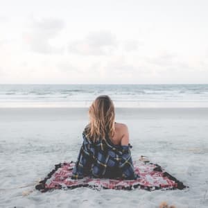 Woman on beach in autumn