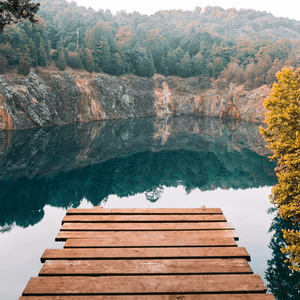 Boardwalk to lake near mountains