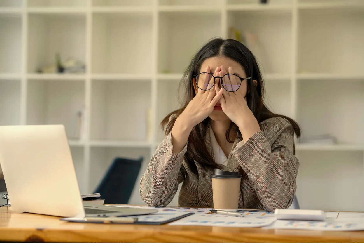 A desk crowded with video call windows, which then settles into a single calm workspace